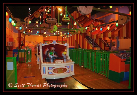 Toy Story Mania rider gets ready for a series of 3-D midway computer games in Disney's Hollywood Studios, Walt Disney World, Orlando, Florida