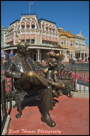 Minnie Mouse shares a park bench with Roy Disney in the Magic Kingdom, Walt Disney World, Orlando, Florida.