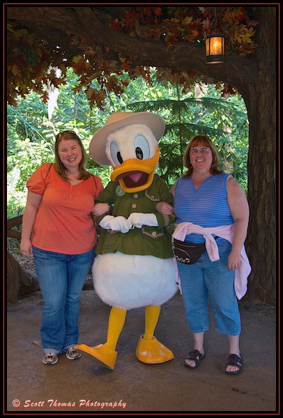 Ranger Donald Duck posing with guests at Camp Minnie-Mickey in Disney's Animal Kingdom, Walt Disney World, Orlando, Florida