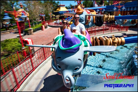 Young family riding Dumbo the Elephant in Fantasyland at the Magic Kingdom, Walt Disney World, Orlando, Florida