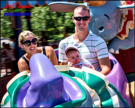 Young family riding Dumbo the Elephant in Fantasyland at the Magic Kingdom, Walt Disney World, Orlando, Florida
