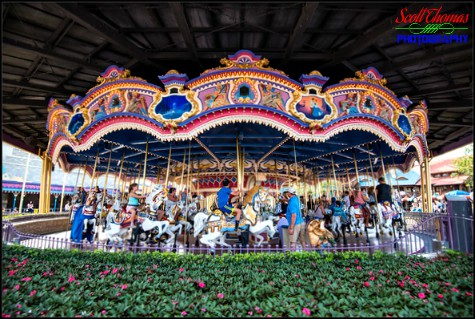 Guests riding the Prince Charming Regal Carrousel in Fantasyland at the Magic Kingdom, Walt Disney World, Orlando, Florida