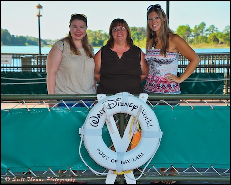 Members of a family getting ready to board a Motor Cruiser at the Magic Kingdom, Walt Disney World, Orlando, Florida