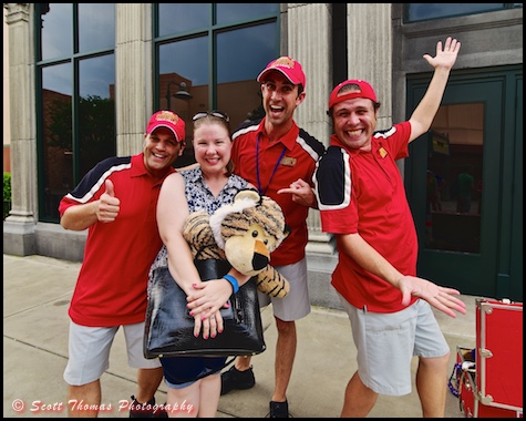 A young woman poses with an improv group after helping them with a skit at Disney's Hollywood Studios, Walt Disney World, Orlando, Florida