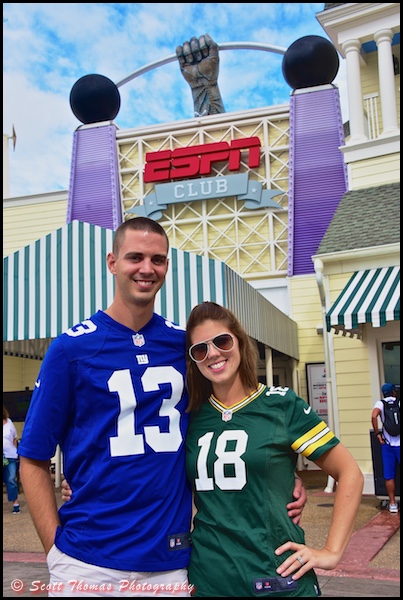 A young sports-minded couple outside the ESPN Club at Disney's Boardwalk Resort, Walt Disney World, Orlando, Florida