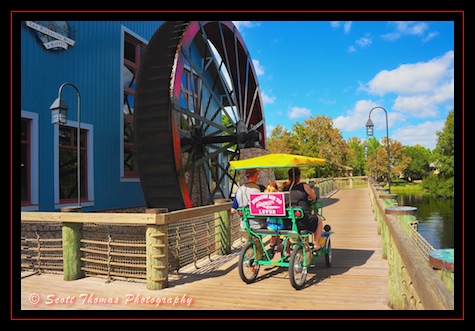 A family taking a Surrey Bike for a spin at the Port Orleans-Riverside resort, Walt Disney World, Orlando, Florida