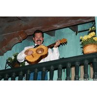 A guitarist plays from above giving the Mexico pavilion it's romantic appeal.