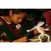Alba Mexico - Alba carefully handpaints a colorful lizard.