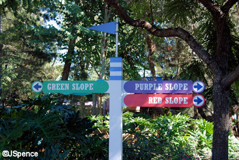 Red, Green, and Purple Sign Post
