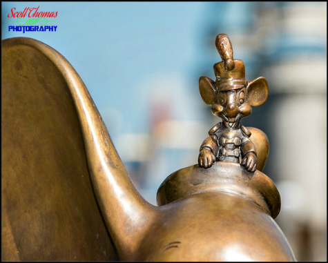 Timothy Q. Mouse on the Dumbo statuette on the Main Street Plaza Gardens in the Magic Kingdom, Walt Disney World, Orlando, Florida Timothy Q. Mouse on the Dumbo statuette on the Main Street Plaza Gardens in the Magic Kingdom, Walt Disney World, Orlando, Florida