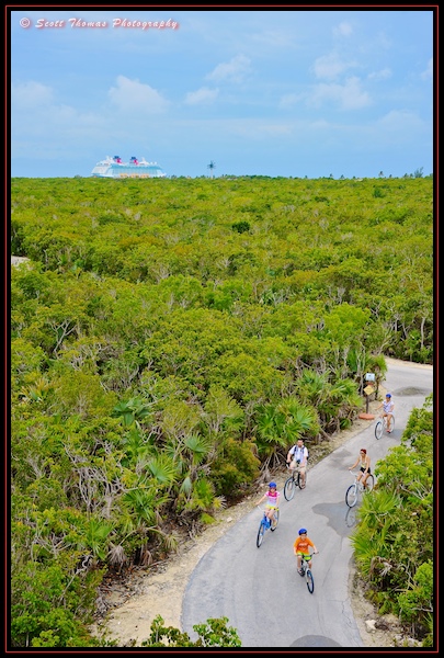 A family riding rented bikes on Castaway Cay during a Disney Dream cruise.
