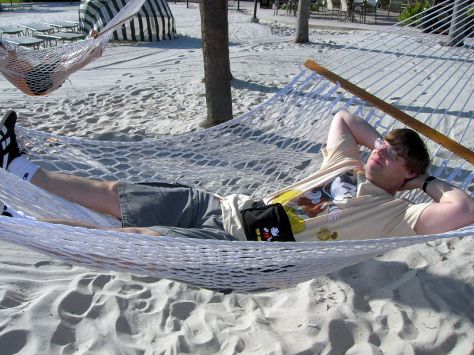 Picture This! blogger, Scott, relaxing in a hammock on the Polynesian Resort beach, Walt Disney World, Orlando, Florida.