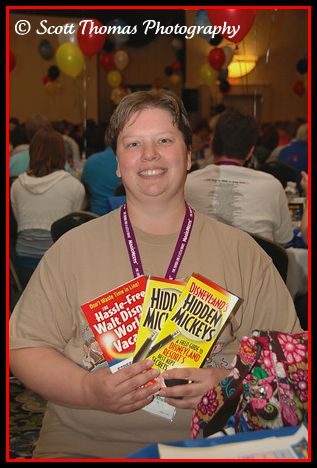 A happy Pamela Berkheiser poses with her Hidden Mickey prize package she won at MagicMeets on Saturday, July 19, in Harrisburg, PA.