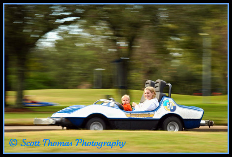 An Indy Car at speed in the Magic Kingdom, Walt Disney World, Orlando, Florida.