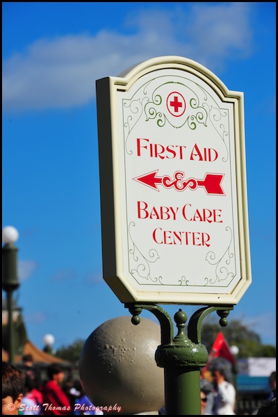 First Aid and Baby Care sign near the Crystal Palace restaurant in the Magic Kingdom, Orlando, Florida.