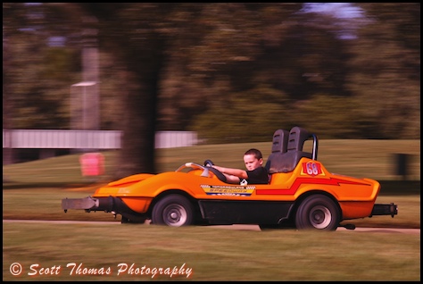 Panned photo of a race car on the Tomorrowland Speedway in the Magic Kingdom, Walt Disney World, Orlando, Florida.