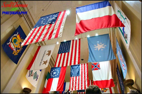 History of American flags hang over the escalators in the American Adventure pavilion in Epcot's World Showcase, Walt Disney World, Orlando, Florida