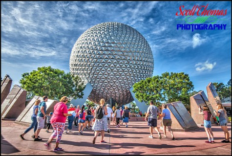 Guests walking towards Spaceship Earth after rope drop in Epcot's Future World , Walt Disney World, Orlando, Florida