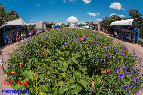 Spaceship Earth rising behind a flower bed in Epcot's Future World, Walt Disney World, Orlando, Florida