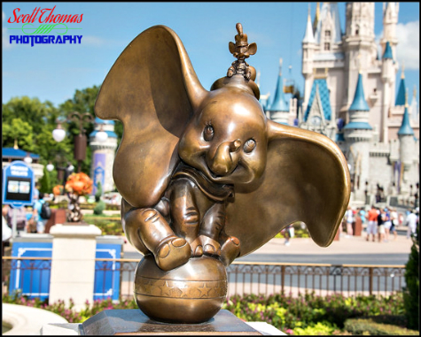 Dumbo with Timothy Q. Mouse statuette on the Main Street Plaza Gardens in the Magic Kingdom, Walt Disney World, Orlando, Florida Dumbo with Timothy Q. Mouse statuette on the Main Street Plaza Gardens in the Magic Kingdom, Walt Disney World, Orlando, Florida