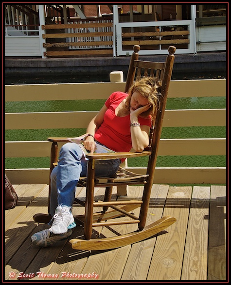 A guest takes a nap in a rocking chair on Tom Sawyer Island in the Magic Kingdom, Walt Disney World, Orlando, Florida A guest takes a nap in a rocking chair on Tom Sawyer Island in the Magic Kingdom, Walt Disney World, Orlando, Florida