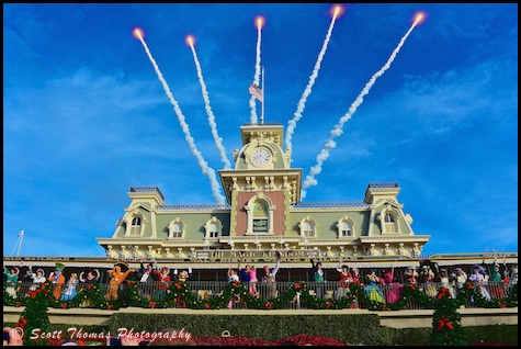 Fireworks go off at the end of the Magic Kingdom's daily opening ceremony show on the Main Street USA Train Station platform, Walt Disney World, Orlando, Florida