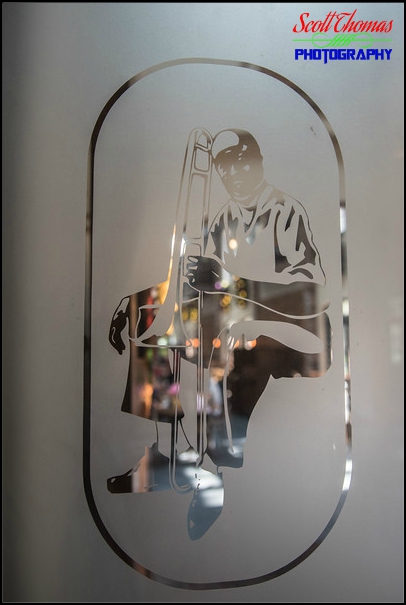 Glass etching of a musician with a trumpet at Disney's Port Orleans French Quarter resort, Walt Disney World, Orlando, Florida