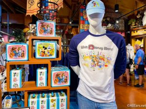 https://allears.net/wp-content/uploads/2021/09/2021-wdw-disney-world-disney-springs-marketplace-co-op-vault-collection-50th-anniversary-preview-center-t-shirt-and-lunchboxes-300x225.jpg