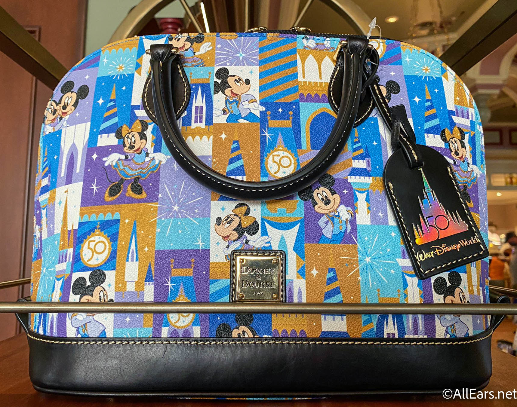 PHOTOS: Disney World Just Dropped A New 50th Anniversary Dooney & Bourke Bag  — And it's EPIC