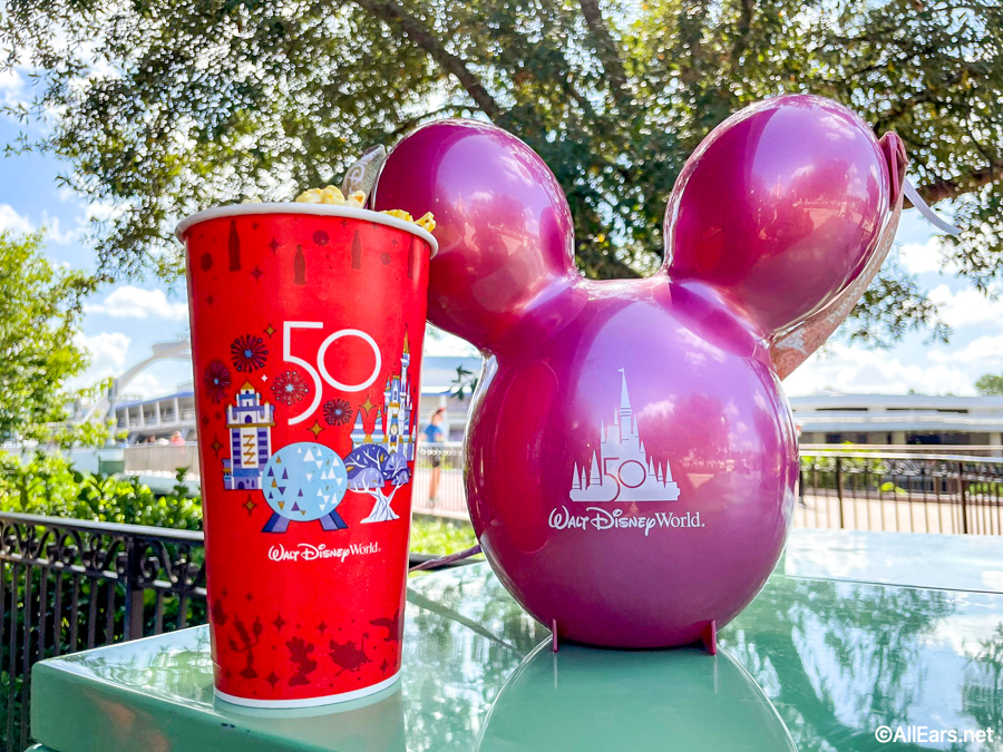 https://allears.net/wp-content/uploads/2021/10/Disney-50th-Anniversary-Popcorn-Bucket-Magic-Kingdom-Balloon-Ears-Pink-Popcorn-Cart-Hub-2.jpg
