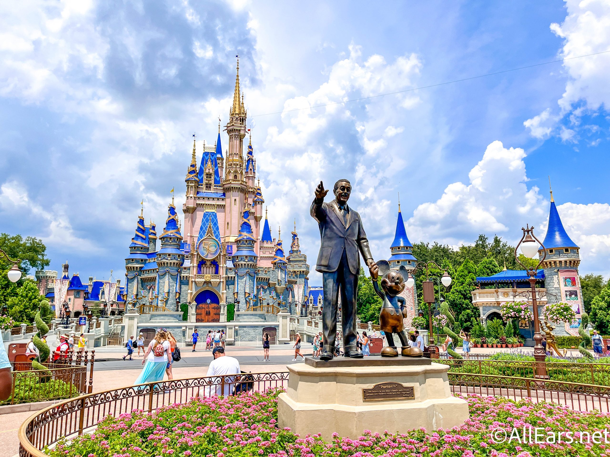 https://allears.net/wp-content/uploads/2022/08/wdw-2022-magic-kingdom-cinderella-castle-stock-partners-statue-walt-and-mickey-scaled.jpg