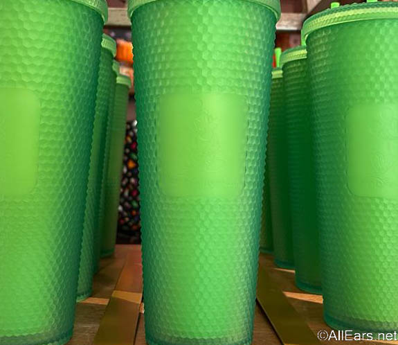 https://allears.net/wp-content/uploads/2022/09/2022-wdw-mkemporium-magic-kingdom-starbucks-green-tumbler-cup-drink-1.jpg