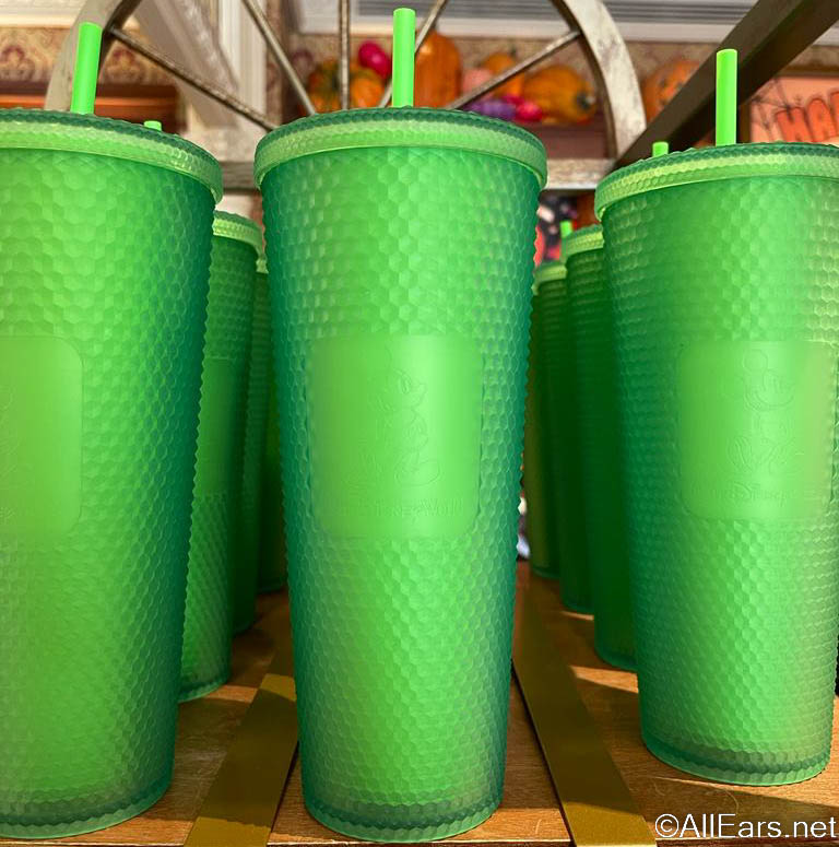 https://allears.net/wp-content/uploads/2022/09/2022-wdw-mkemporium-magic-kingdom-starbucks-green-tumbler-cup-drink-2.jpg