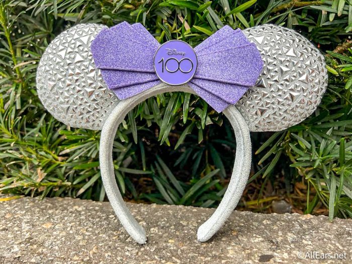 https://allears.net/wp-content/uploads/2022/12/2022-wdw-mk-magic-kingdom-emporium-100th-anniversary-minnie-ears-3-700x525.jpg