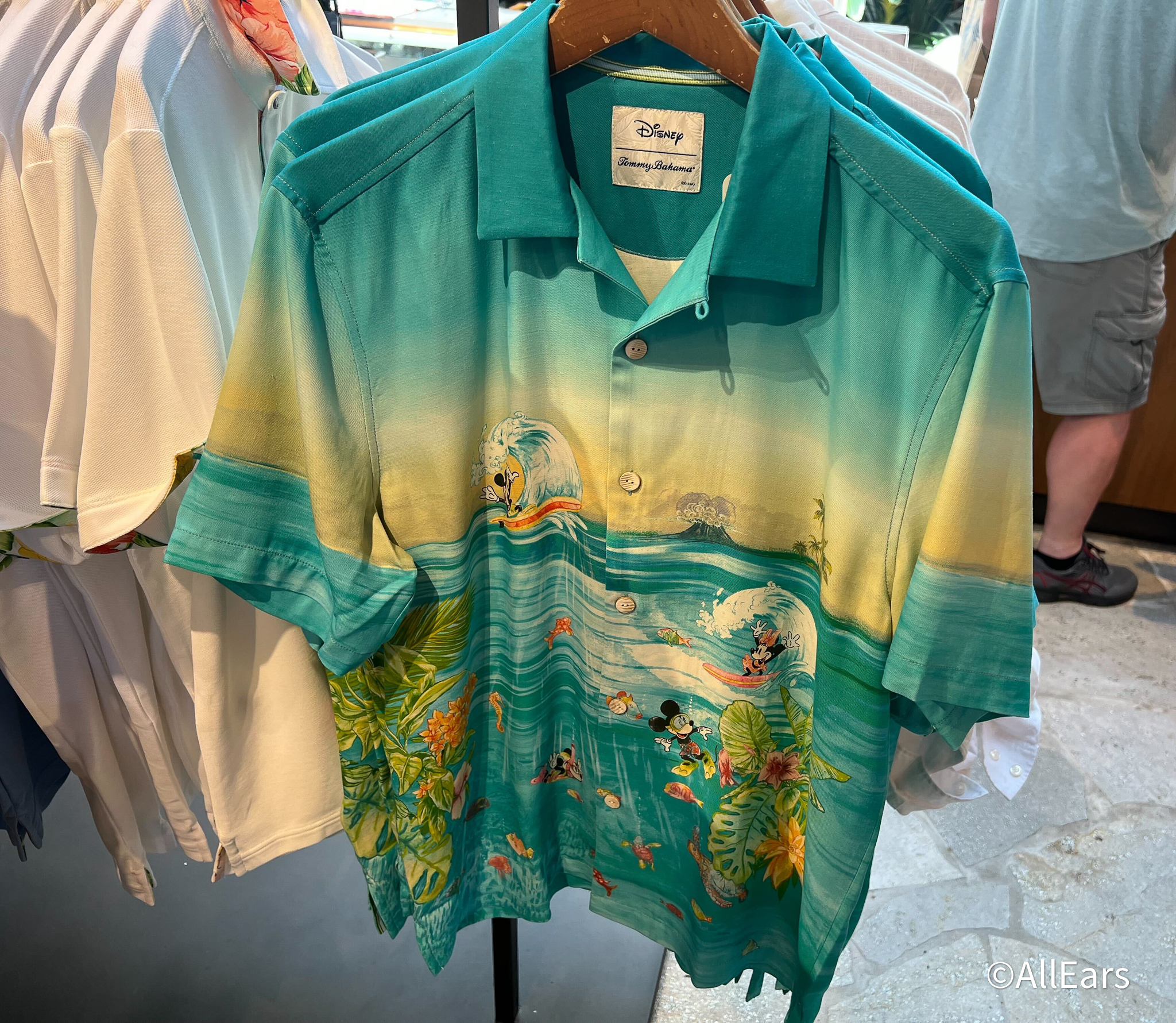 https://allears.net/wp-content/uploads/2023/03/2023-wdw-disney-springs-tommy-bahama-mickey-and-minnie-surfing-green-button-up-shirt.jpg