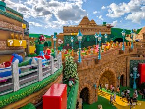 bright and colorful yoshi ride vehicles on bridge